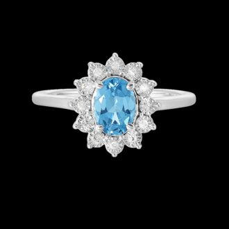 Fashion Ring with Oval Blue Topaz and .05ctw Round Diamonds in Halo Design