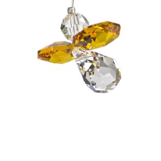 This exquisite November Guardian Angel figurine comprises of crystal elements, imbued with the birthstone of the month - Topaz. Symbolizing protection and warmth, it is designed with great detail, from delicate wings to a finely crafted body, this jewel-encrusted piece brings a heavenly sparkle and its symbolic resonance to any display collectable or room decor.